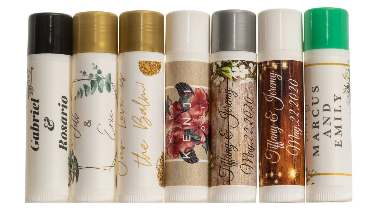 Personalized wedding lip balm favors with couples names, dates, floral and greenery labels